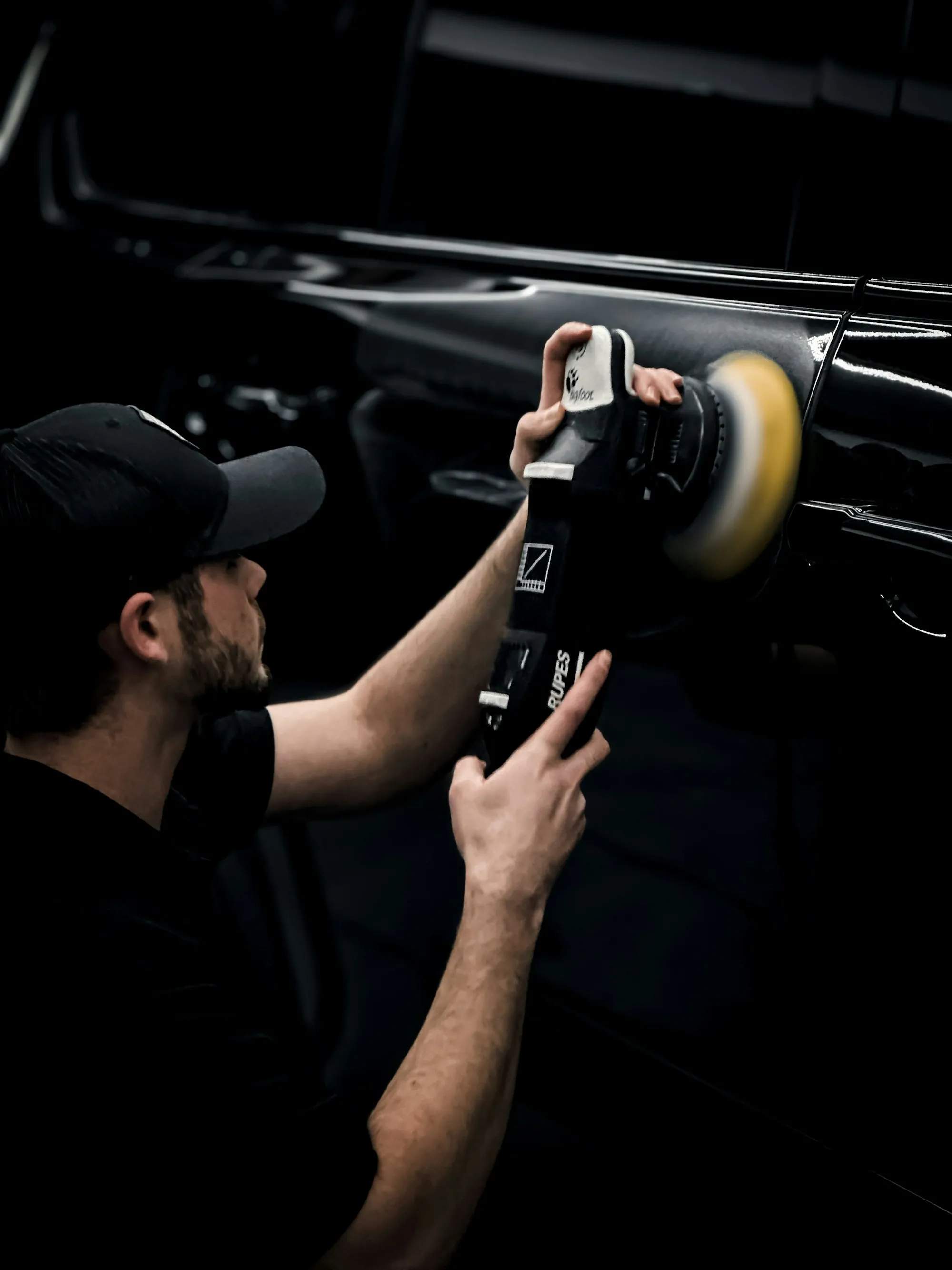 Technician working inside a car's cabin